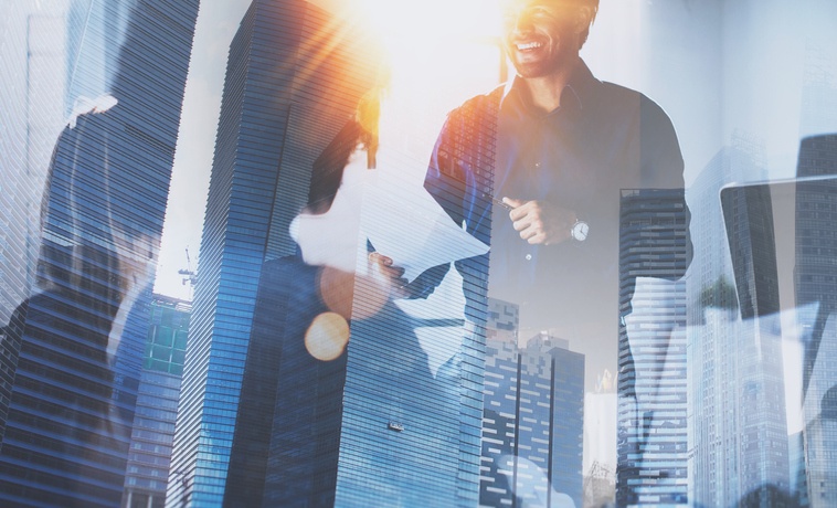 Teamwork concept process.Young team of coworkers making great business discussion in modern coworking office.Double exposure,skyscraper building blurred background.Horizontal.Flares effect.